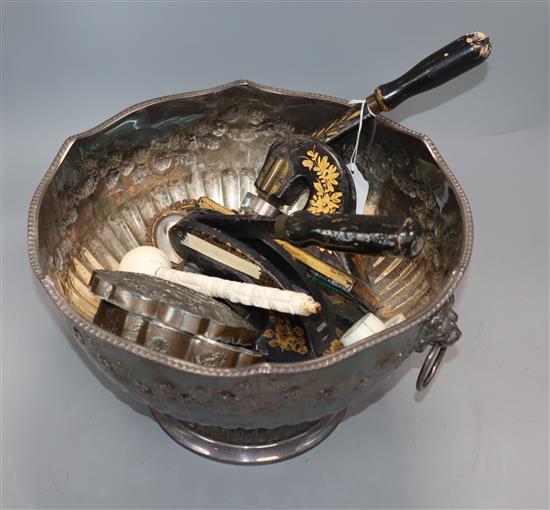 A plated punch bowl, two portrait miniatures on ivory, an ivory ornament, two cast iron punches and a box